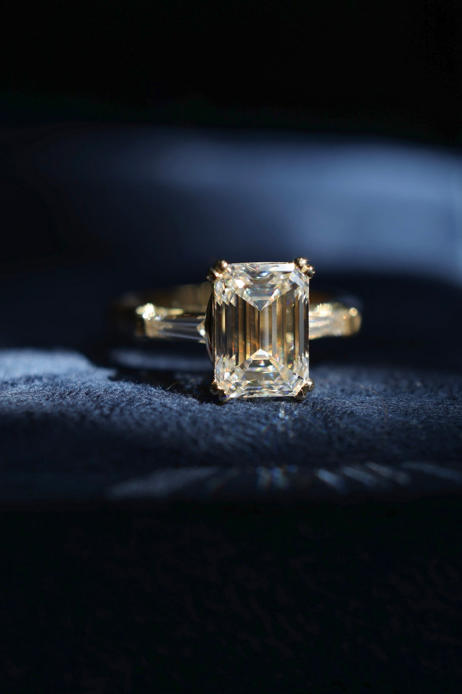 Emerald cut and tapered baguette engagement ring 