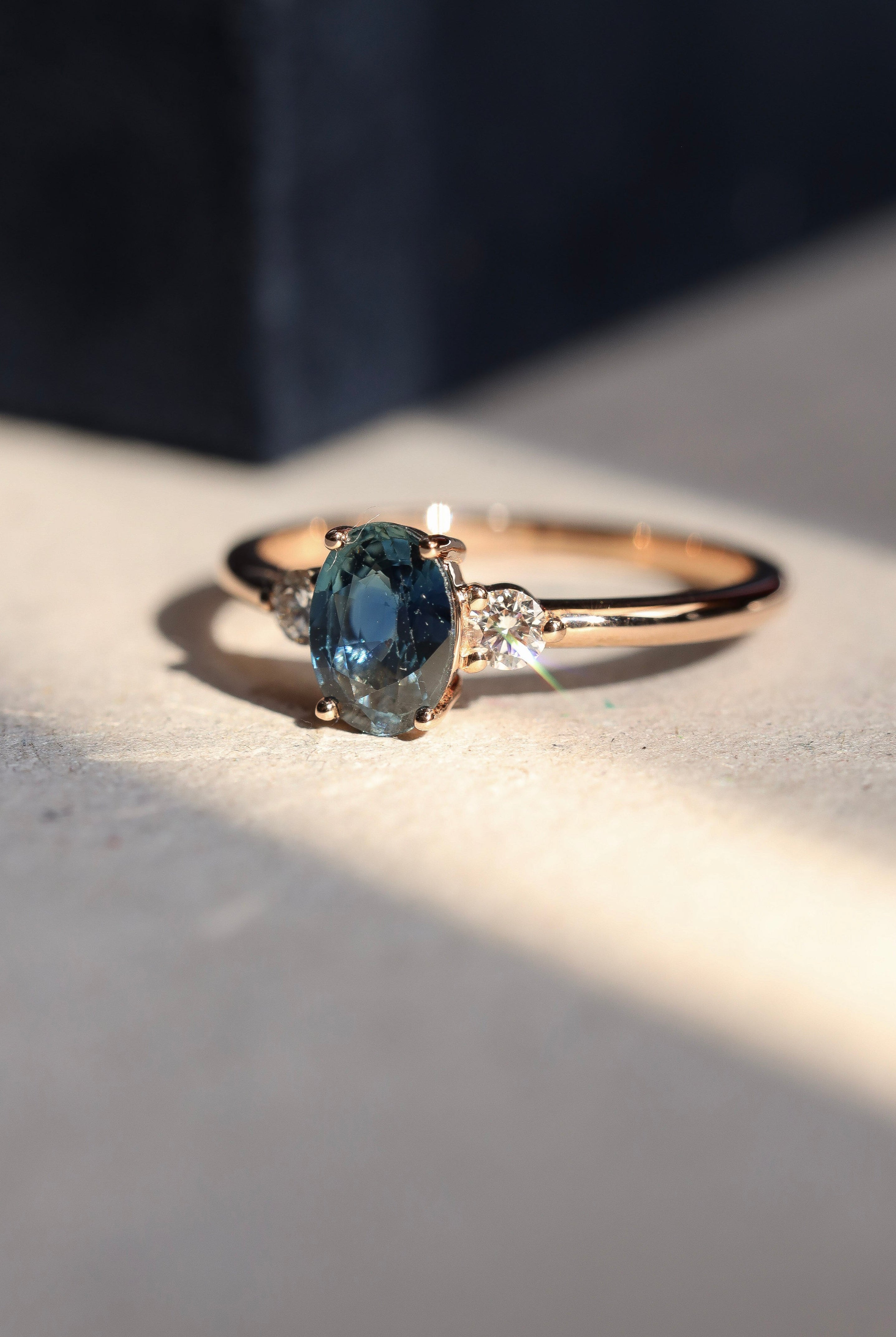 teal sapphire and diamond trilogy ring 