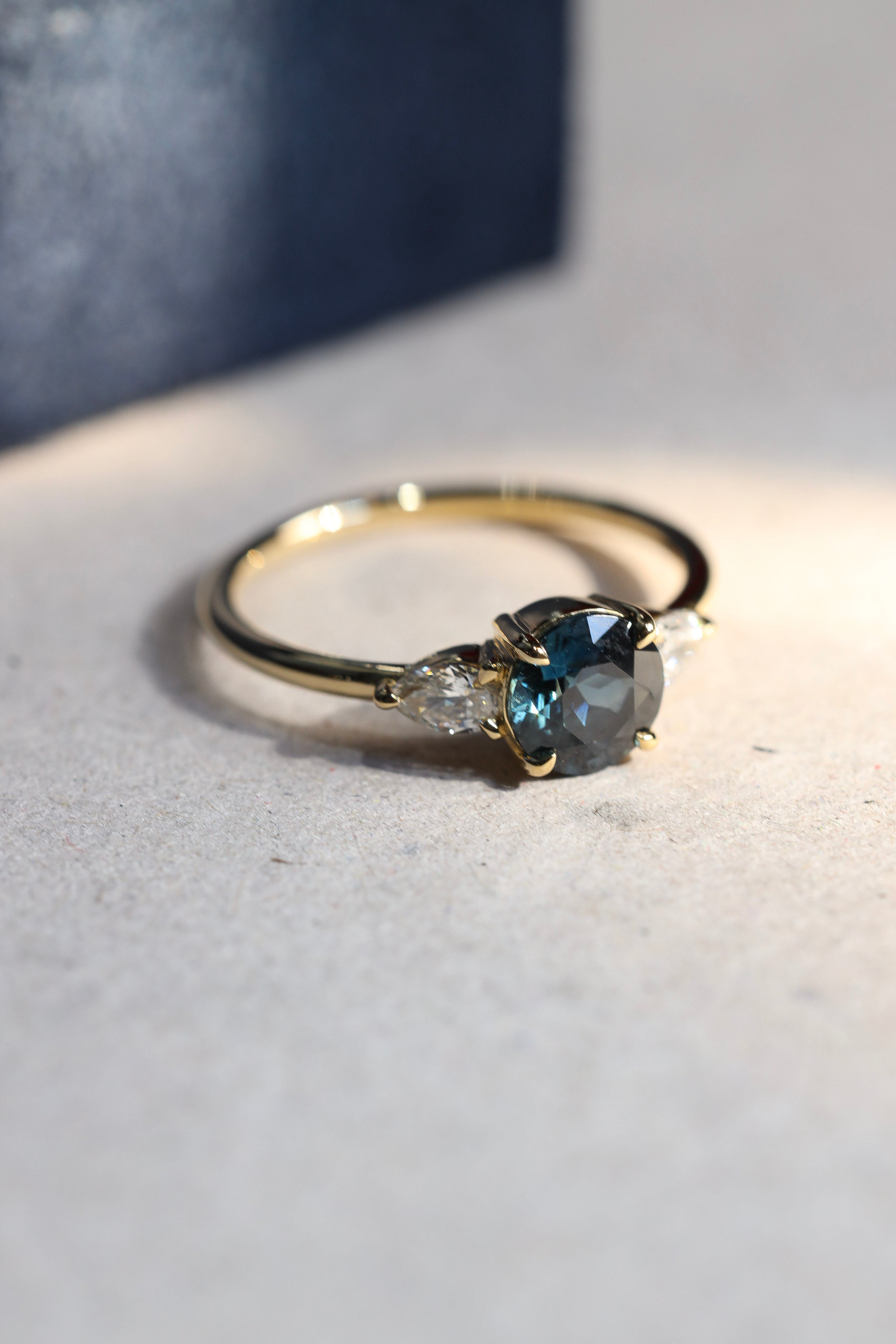 sapphire and pear diamond trilogy ring 