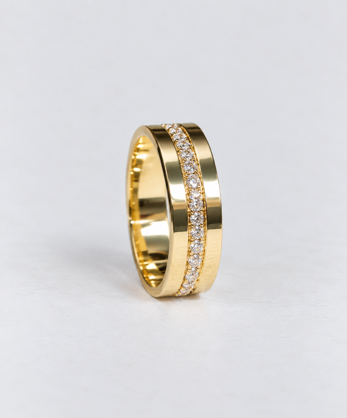 a cigar band featuring a row of diamonds set through the centre